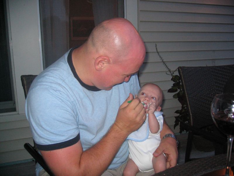Sebastian eating cereal for the first time